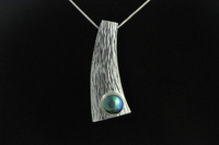 Paua pearl and hammer forged Sterling silver pendant
