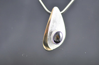 Asymmetric reticulated Sterling silver and black Star Sapphire pendant