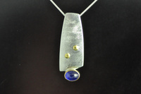 Asymmetric Silver and 22ct gold Blue Sapphire Pendant