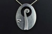 Koru oval silver pendant