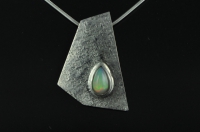 Five sided textured silver pendant with teardrop Welo Ethiopian Opal 