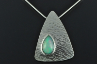 Curvaceous silver triangle and tear drop multi colour Welo opal pendant