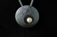 White pearl in hollowform darkened Sterling silver pendant