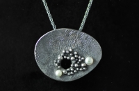 Asymmetric reticulated granulated blackened silver pendant with two white pearls