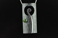 Koru and Pounamu silver pendant,