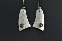 Ruby and textured silver earrings