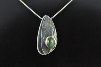 Chatoyant Pounamu and silver pendant