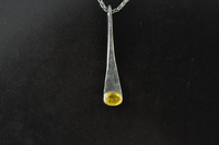 Yellow sapphire, 22ct gold and blackened silver pendant