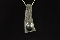 Black mabe pearl and textured silver pendant